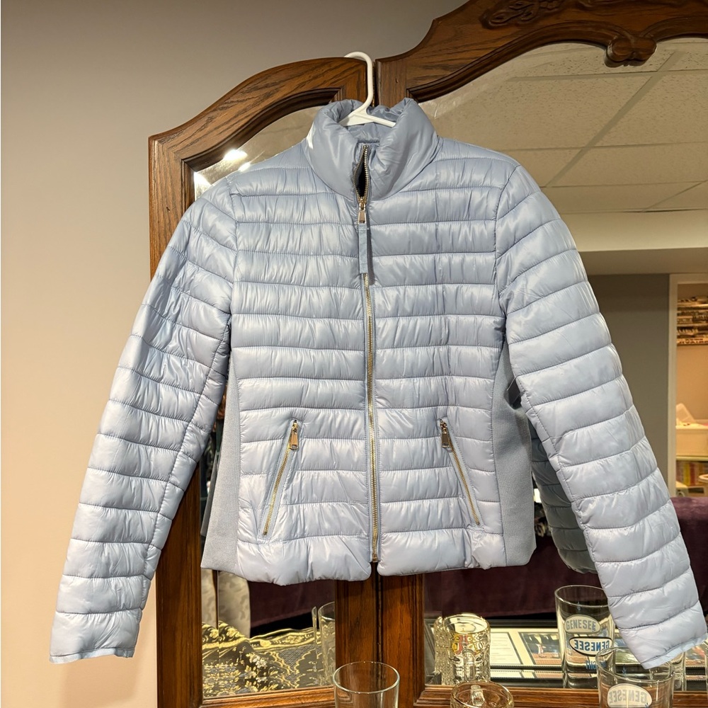 Pretty blue light jacket size large. Never worn